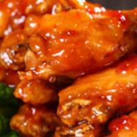 Tavern Wings · Oven-roasted wings flash-fried for a crispy finish served naked style or tossed in BBQ, buff...