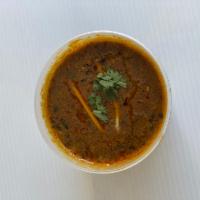 Dal Makhani · Black lentil lentil tempered with tomato and garlic.