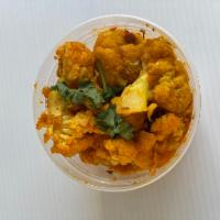 Gobhi Aloo · Fresh cauliflower and potatoes cooked with finely chopped onions, tomatoes, ginger, garlic, ...