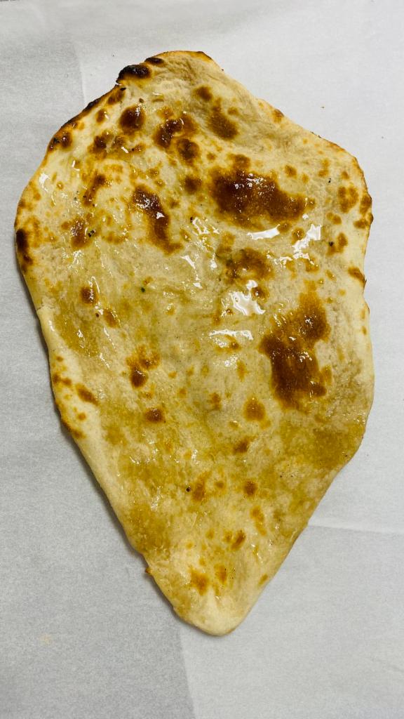 Butter Naan · White flour leavened bread, traditionally baked in a clay oven.