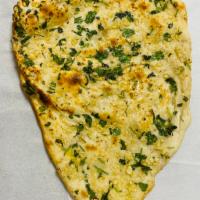 Garlic naan · Indian yeast-leavened bread, traditionally baked in clay oven with chopped garlic on top.