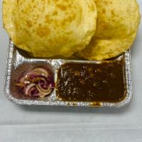 Chana Bhatura · 2 pieces. Fluffy deep-fried leavened bread served with chickpea curry. 8 oz.