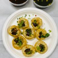 Pani puri · Deep fried balls served 2 flavors of water with potatoes and onions masala
