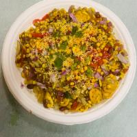 Bhel Puri · Puffed rice as the base, mixed with raw tomato, onion, boiled potatoes, tamarind, and mint c...
