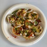 Dahi Puri · Deep fried balls puris stuffed with onions, potatoes and topped with yogurt, chutneys, and s...