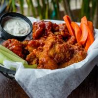 House Wings · Breaded wings tossed in honey spiked house sauce with choice of dressing