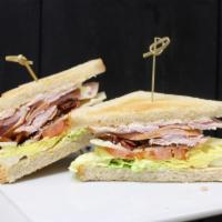 Club House Sandwich · Smoked turkey, applewood smoked bacon, lettuce, Swiss cheese, mayo, and tomato.