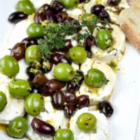 Olive Plate · Chef's selection of marinated olives served with goat cheese and smoked almonds.
