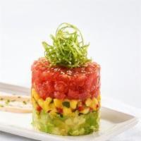 Ahi Tuna Stack · Sushi grade tuna tossed with fresh herbs and citrus, stacked with avocado, cucumber, and man...