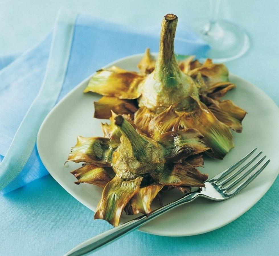 Carciofi alla Giudea · Roman-style baby artichokes sauteed with extra virgin olive oil, garlic, basil, and parsley.