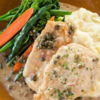 Vitello Piccata · Veal scaloppine sauteed with capers and served in a silky lemon-butter sauce. Served with ma...