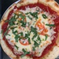 Margherita Pizza · Tomato sauce, fresh sliced tomatoes, basil, and mozzarella slices.