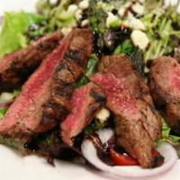 Bistro Steak Salad · Grilled bistro filet sliced and served on a bed of mixed field greens with tear-drop tomatoe...