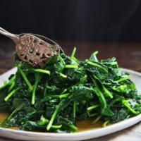 Spinach · Prepared either steamed or sauteed with oil and garlic.