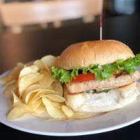 Famous Grilled Chicken Sandwich  · Wonderful Grill Chicken Sandwich with mayonnaise, tomatoes, lettuce, onion served on a Kaise...
