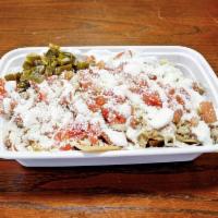 Chicken Nachos · Corn tortilla chips. Chicken with beans, melted cheese, sour cream, jalapeno and tomatoes.