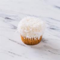 Coco Loco Cupcake · Coconut cupcake topped with shredded coconut flakes.