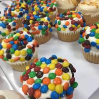 M&Ms Cupcake · If you love M&Ms you will love this super moist soft classic cupcake topped and rolled in M&...