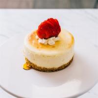 Mini Cheesecake · A 4 inch NY Styled Baked Cheesecake topped with a strawberry.