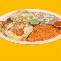 Huevos Rancheros Plate · Eggs, salsa, hash browns, Mexican cheese, rice, beans, and tortilla.