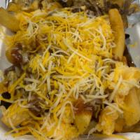 Chili and Cheese Fries · Fried potatoes topped with cheese and chili.
