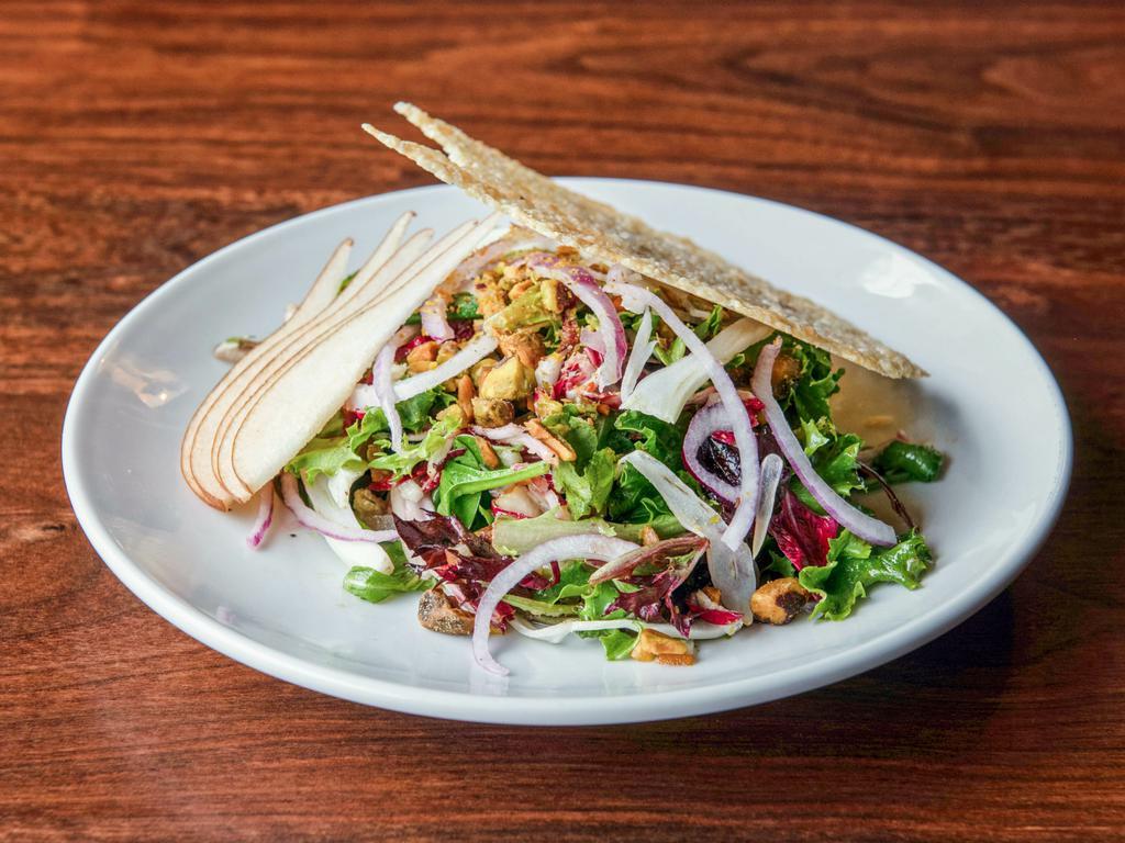White Lace Salad · Arugula, romaine, radicchio, toasted pistachio, shaved fennel and pear, red onion, vanilla bean white balsamic vinaigrette, Swiss and Parm tuille. Gluten free. Vegetarian.
