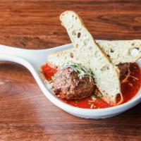 Homemade Meatballs · 2 family recipe meatballs with family red sauce, fresh herbs 
and Parmesan.
