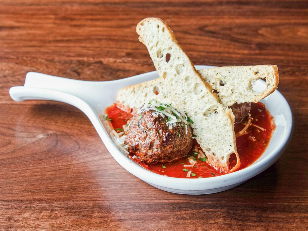 Homemade Meatballs · 2 family recipe meatballs with family red sauce, fresh herbs 
and Parmesan.