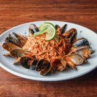 Red Curry Mussels · Angel hair, red curry, coconut milk, family sauce, PEI mussels, fresh lime.