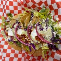 Tinga Taco Dorado · Included: lettuce, pickled onion, queso fresco, salsa.