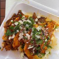 Birria Queso Tacos · 2 Corn tortillas smothered in Consume', Melted cheese, topped with onions and cilantro.