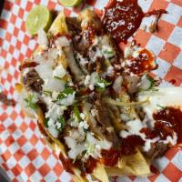 Jumbo Birria de res Quesadilla  · Quesdilla topped with onion, cilantro, sour cream, queso fresco and choice of green or red s...