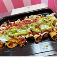 Taquitos (4 pcs) · Choose meat or potatoes, Topped with lettuce, queso fresco, pickled onion red or green salsa.