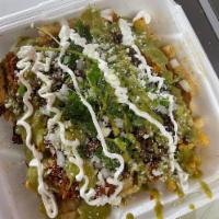 Carne Asada Fries  · Melted Cheese, Guacamole, Salsa, Sprinkle of queso fresco
