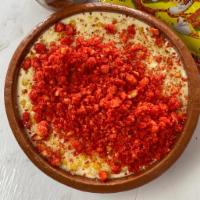 Hot Cheetos Elote · Corn, mayo sour cream, butter, topped with parm cheese, topped with tajin and hot cheetos