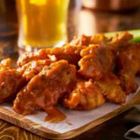 Buffalo Wings · Fresh batch of chicken wings topped with Buffalo sauce.
