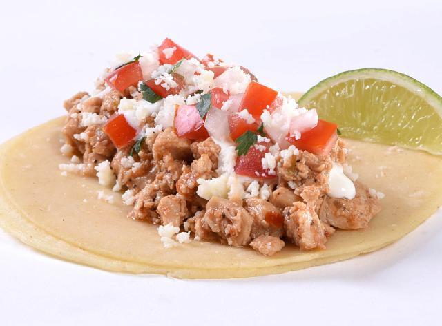Chicken Street Taco Lime Crema · Marinated chicken, or black beans with pepita seeds, fresh pico de gallo, homemade lime crema sauce and Cotija cheese crumbles, all wrapped in lightly grilled corn tortillas and served with a lime wedge.