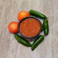Amigos Spicy Salsa · 1 oz. portion of Amigos Spicy Salsa made from scratch