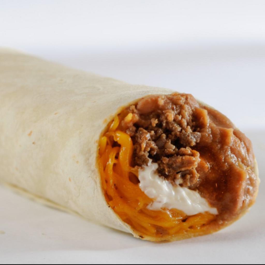 Combo Burrito · Seasoned ground beef, refritos, cheese, enchilada sauce and sour cream rolled in a soft flour tortilla.