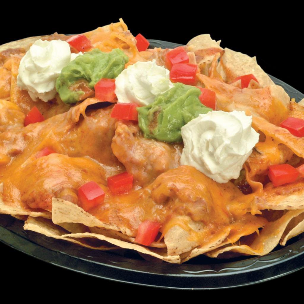 Nacho · Crisp corn chips covered with refritos, enchilada sauce, melted cheddar and jack cheese, and topped with guacamole, sour cream and tomatoes.