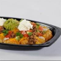 Mexi Fry Nacho · Golden, crisp Mexi fries covered with refritos, ranch dressing, cheese sauce and seasoned gr...
