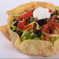 Taco Salad · Lettuce blend, seasoned ground beef, cheddar cheese, black olives, green onions and tomatoes...