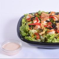 Southwest Chicken Salad · A bed of lettuce topped with spicy breaded chicken, cheddar cheese, pico de gallo, corn and ...