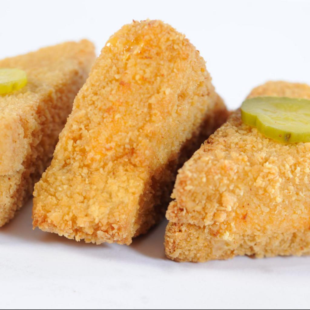 Cheese Frenchee · Sandwich with American cheese and salad dressing that’s hand-dipped in egg batter and cracker crumbs and fried to a golden brown. 3 triangle sections with 2 sliced pickles in an order.