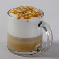 Macchiato · Monin® caramel syrup and steamed milk topped with espresso garnished with froth and caramel ...