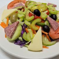 Cold Antipasto · An assortment of Italian meats, cheeses and olives, served on a tossed salad with mixed gree...