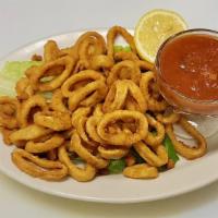 Fried Calamari · Rings of fresh squid - calamari - that are coated in a flour batter then deep fried. Served ...