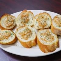 Garlic Bread · Fresh Italian bread rubbed generously with butter and fresh garlic, then broiled until toast...