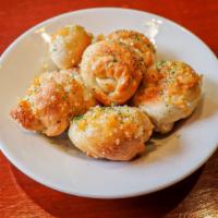 6 Garlic Knots · Pieces of fresh pizza dough, rolled into a knot-shape, then coated with butter and garlic. B...