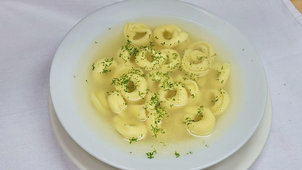 Tortellini in Brodo Soup · A stuffed cheese pasta, shaped in a circle, served in a steaming chicken broth. 